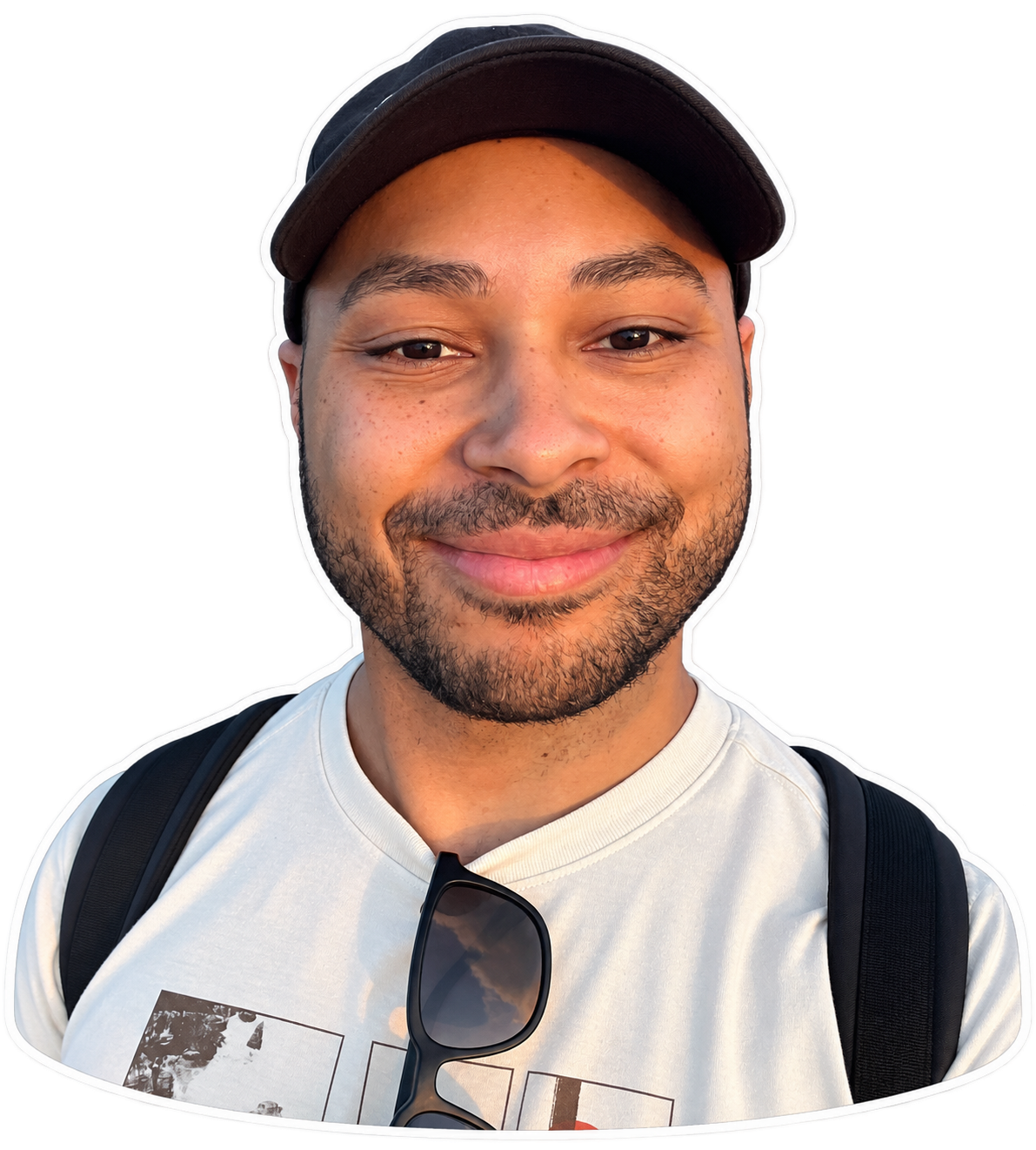 Lionel smiling in a black cap